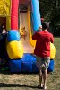 Food Appreciation Day at Spy Pond Field brought many children to the bouncy house and slide while spectators listened to music and learned about GMOs.