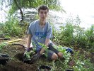 People Making a Difference® volunteer, Will, plants Solomon’s Seal to help curb erosion in planting bed #6.