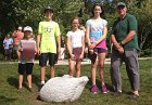 Ryan and Sean Hart, Suzanna and Aliza Kopans and Joseph A. Curro, Jr., Selectman, admire the swan sculpture in its original location as Kevin Duffy, sculptor, stands in the background.