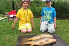 Before releasing their fish back into the pond, brother and sister, Robbie and Katie, show off their first carp they caught nearly at the same time during Jerome Moisand's "Carporama" at the end of June.