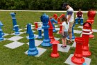 Participants stood with life-sized chess figures made of recycled ductwork designed by Somerville artist, John Tagguiri, learning the moves of the game from a different perspective.