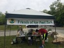 Sally Hempstead, Outreach and Communications CoChair, welcomed volunteers and signed them in on Work Days under the Friends of Spy Pond Park canopy