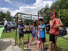 Volunteers from the same East Arlington neighborhood, (l-r) Isaac Provost, Ani Brenne, Hank Fliggburger, and Tor Brenne came to help in Spy Pond Park on August 18