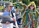 Lally Stowell holding FSPP’s display goose and Scooter Wilkinson dressed as Spy Pond Slime (toxic algae) marched in the Fox Parade in June