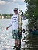 Patrick Karper proudly displayed the 32-35” Muskie estimated to be 11-13lbs. that he caught along the northwest side of Spy Pond on August 22, 2020.