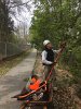 Mal Crawford from the Appalachian Mountain Club pruned bushes with a pole saw.