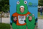 Susan Chapnick, Arlington’s Conservation Commission Chair, Nick and Matthew topped off their Fun Day pleasure via the Mystic River Watershed Association’s peek-through board.   It advertised the May Herring Run and Paddle Races, celebrating the return of Alewife swimming up the Mystic River along E. Arlington’s border with Medford.