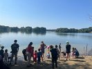 On Fun Day lots of children and their parents stood at North Beach to launch bark boats onto Spy Pond.