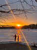 Siblings experienced the sun’s last hurrah over the ice on Spy Pond.