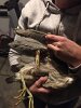 The black-crowned night heron was wrapped up in multiple layers of fishing line and had no less than six hooks in her body--3 on her wing, and 3 in her leg.