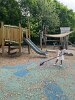 Olivia, our youngest May 17th volunteer, swept errant wood chips to groom the playground.