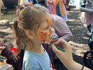 Jade S. was transformed into a fierce little tiger at the face painting station.