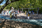 Strollers passed through the playground as eager Fun Day participants sought out their favorite playground equipment.
